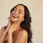 a-woman-with-long-brown-hair-smiling