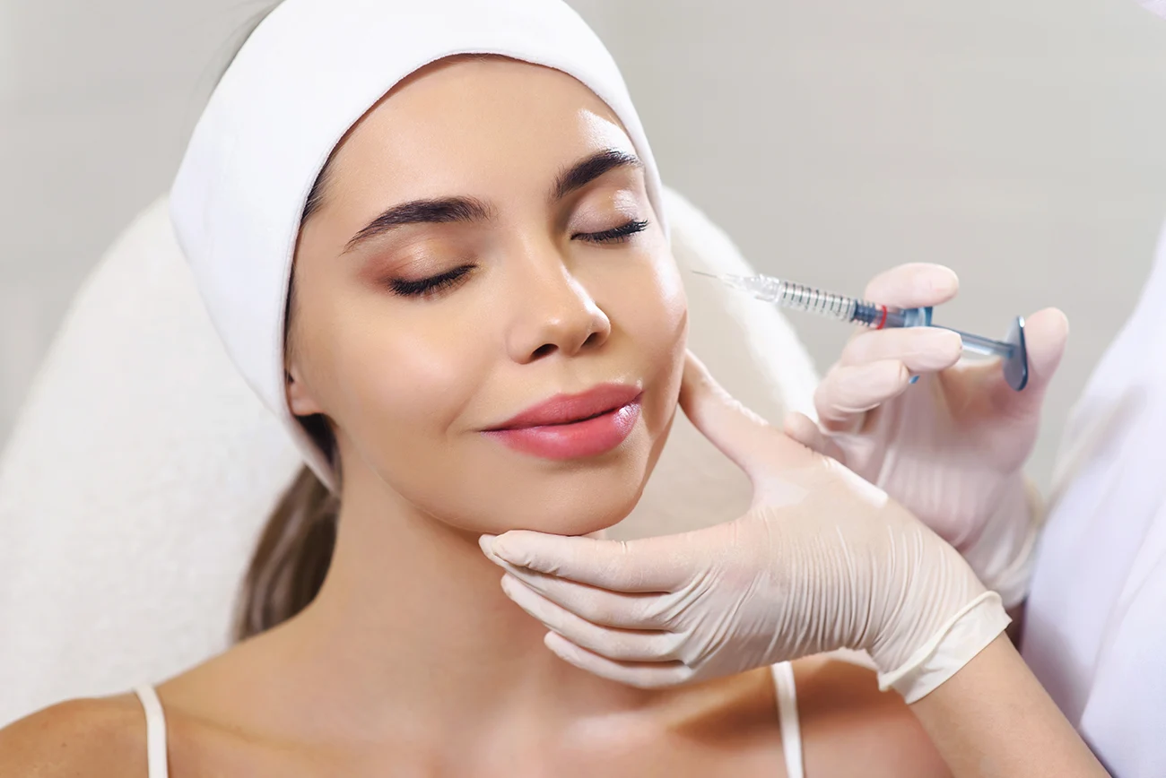 Woman getting a facial injection.